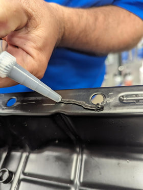 Permatex Ultra Black nozzle close-up for controlled bead application benefit