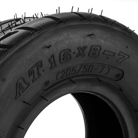 PHILTOP tire on lawn tractor in yard, shows practical utility and traction