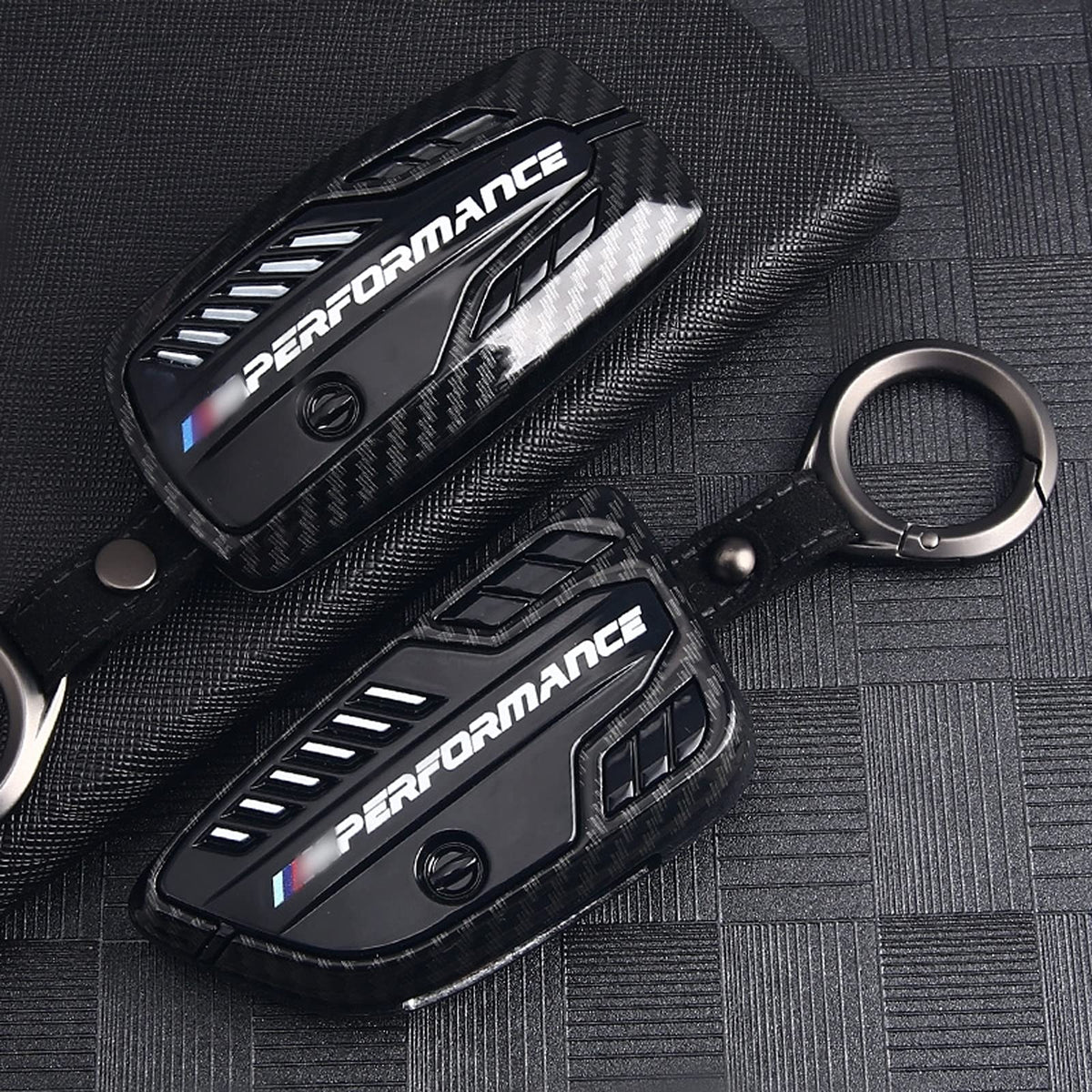 Phmnkl installed on BMW key with logo visible for brand-preserving protection