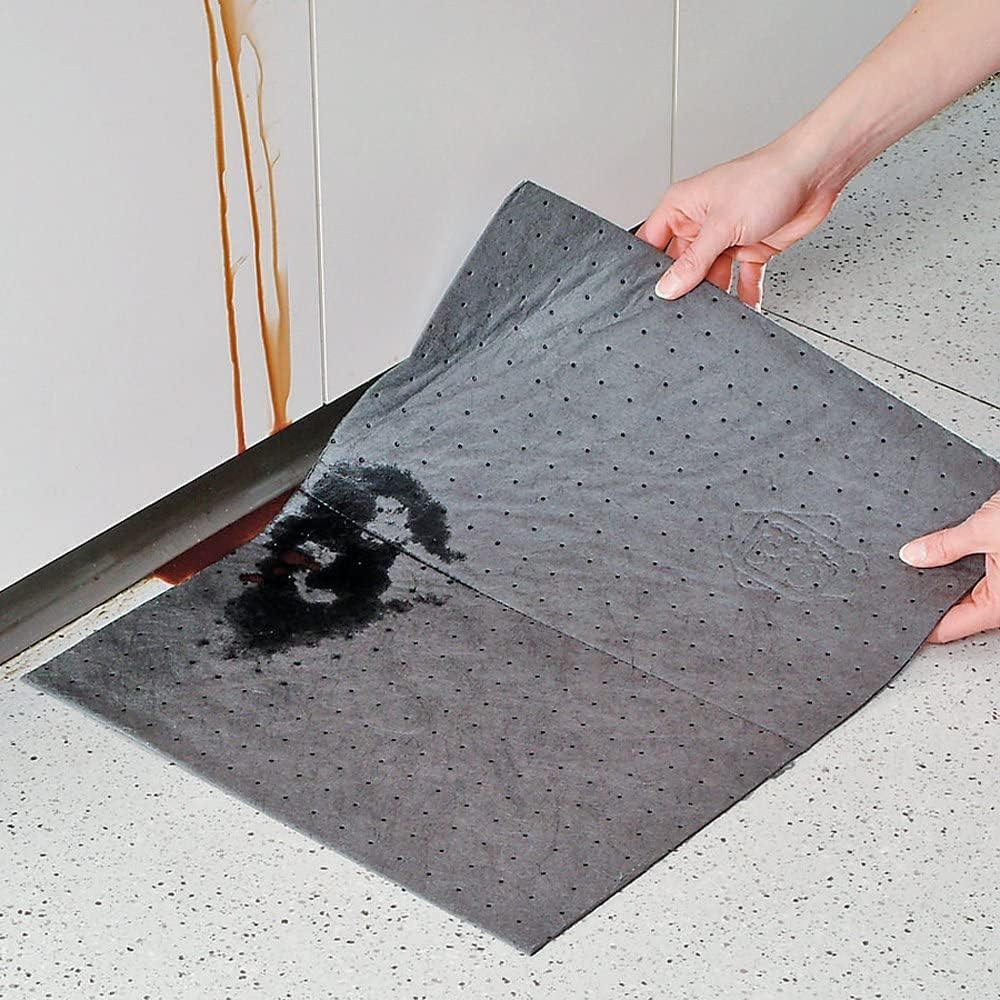 PIG pad on garage workbench catching drips, keeps surfaces clean