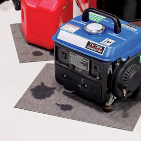 PIG used mat being deposited in a labeled waste bucket to show safe disposal workflow