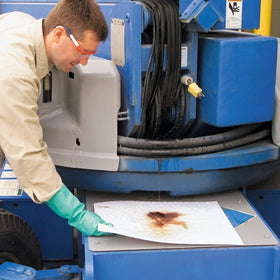 PIG pad next to a handrail for scale showing compact, portable benefit