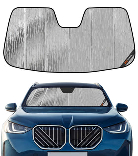 Pigenius front view showing custom-fit sunshade for BMW X3 protecting cabin