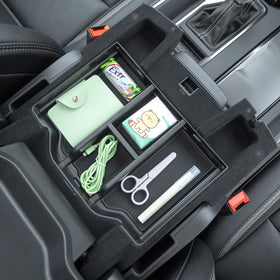PIMCAR detail of reserved charging-port cutout keeping cables organized and accessible
