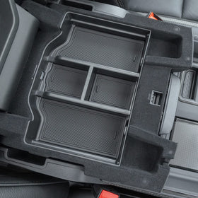 PIMCAR organizer beside phone and wallet illustrating size and quick-reach benefit