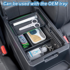 PIMCAR console tray installed around charging pad with phone visible for safe charging