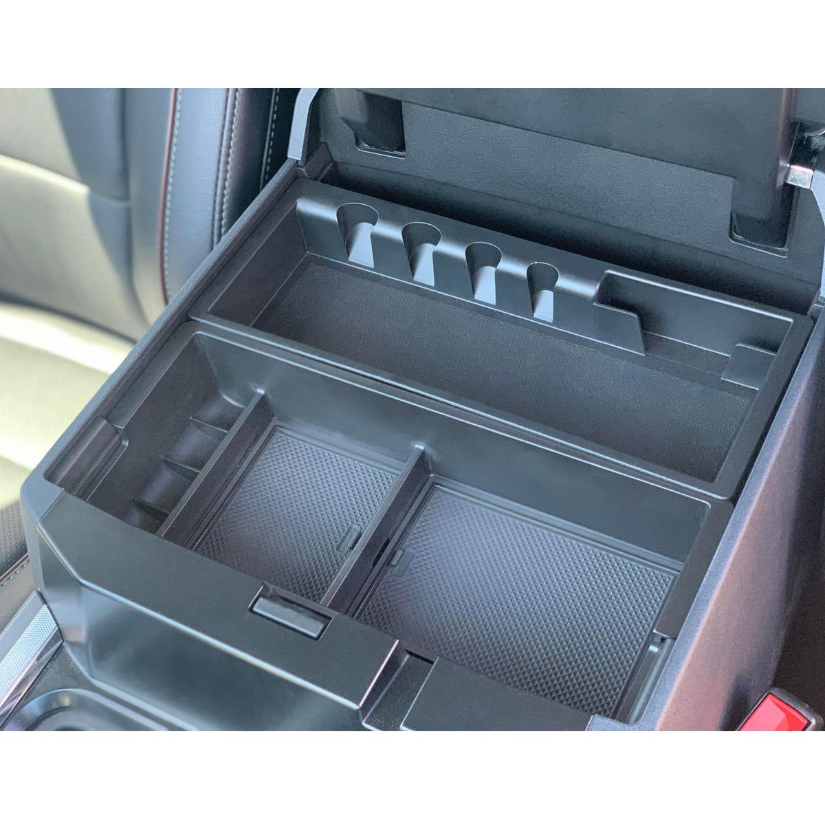 PIMCAR lifestyle photo inside truck cabin highlighting organized center console