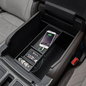 PIMCAR tray being placed into console demonstrating tool-free install