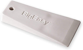 pizety wedge inserted in door frame demonstrating safe gap creation, reduces surface damage