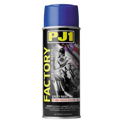 PJ1 spraying Yamaha blue onto a motorcycle fairing for restoration durability