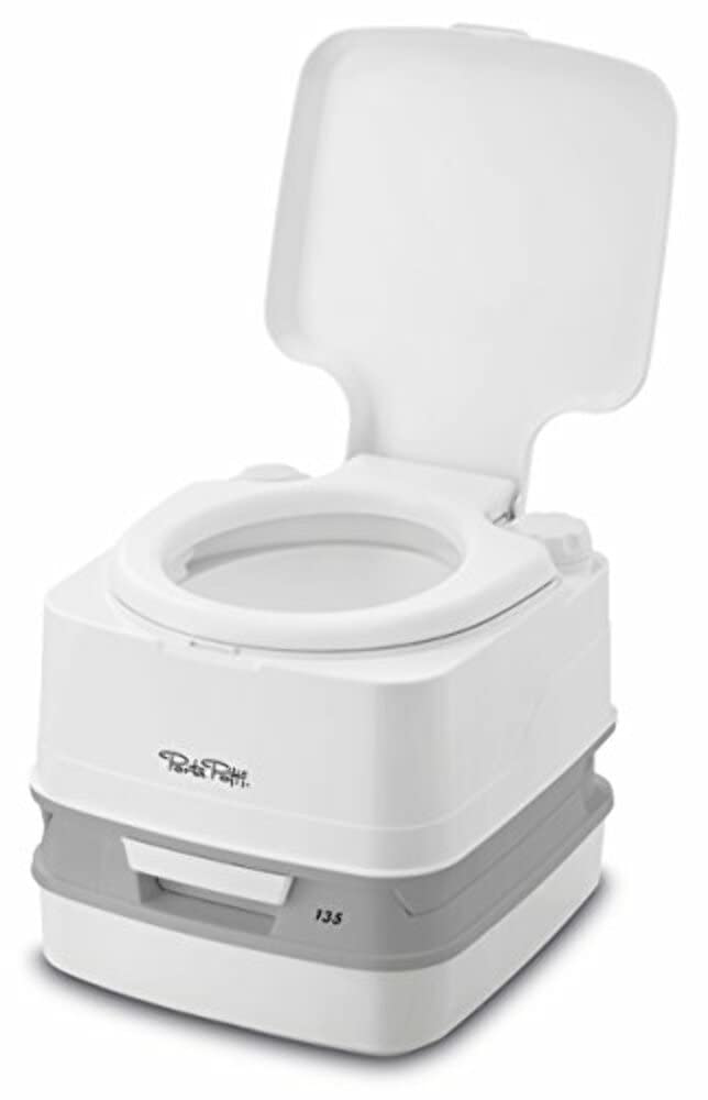 Porta Potti bellows pump in use demonstrating manual flush reliability