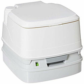 Porta Potti 345 next to backpack demonstrating portable size and scale