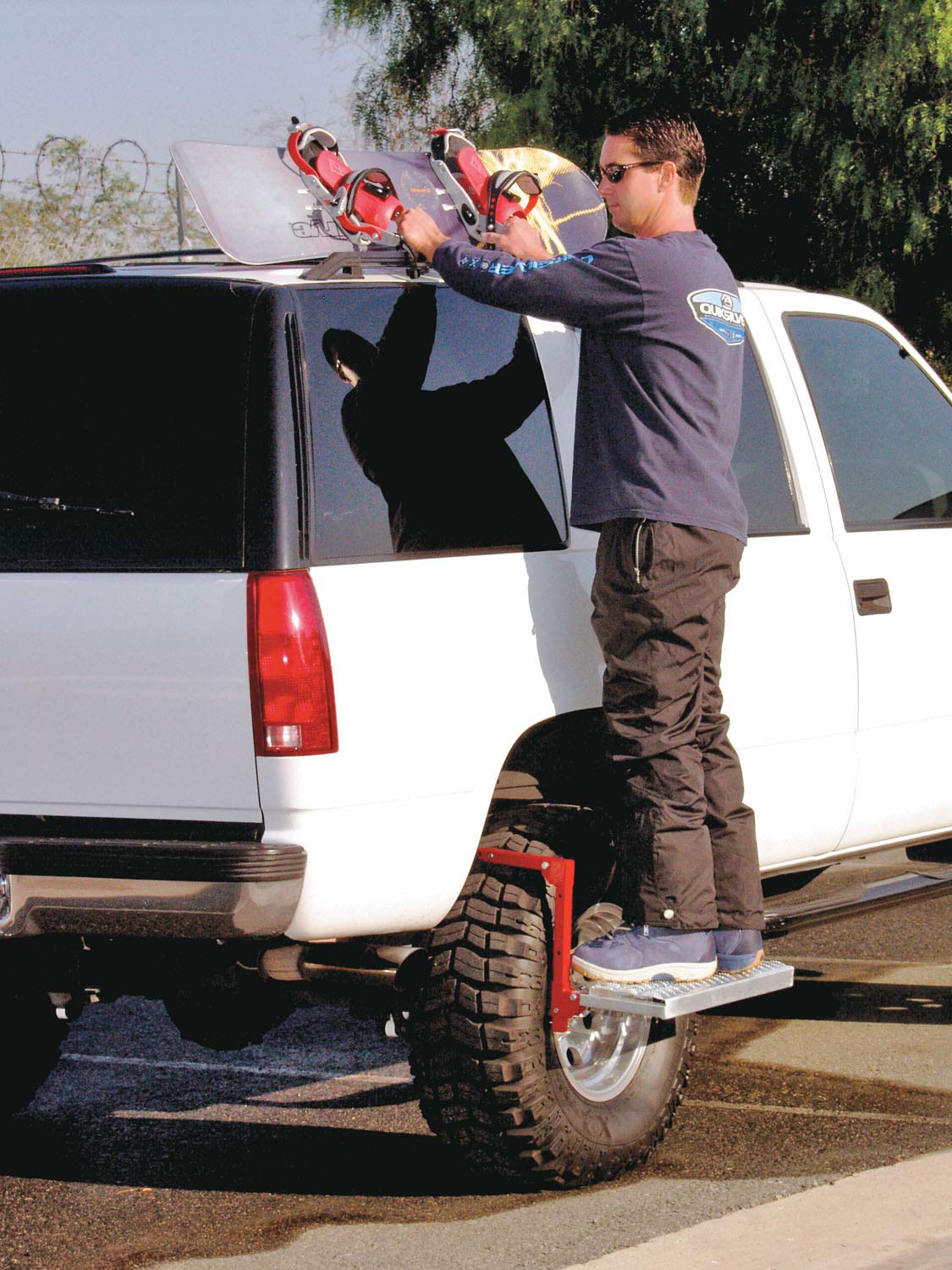 Powerbuilt step next to tire showing scale and fit for quick vehicle access