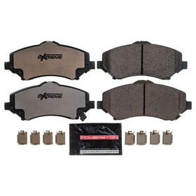 PowerStop pad profile close-up showing carbon-fiber ceramic surface and improved bite