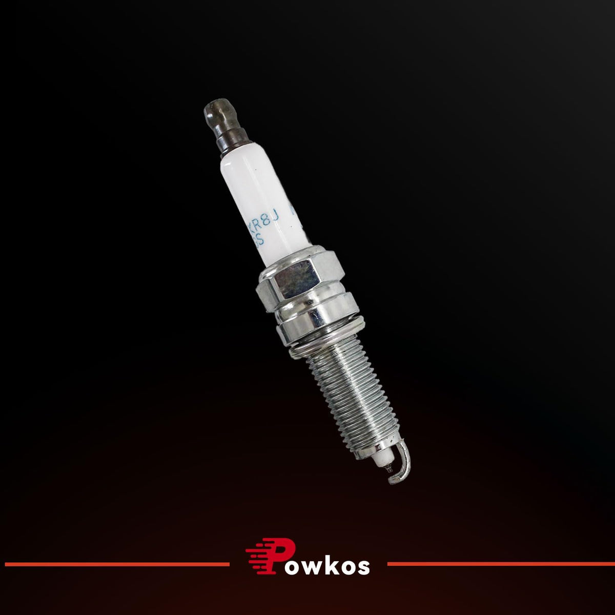 Powkos spark plugs on workbench during garage installation illustrating straightforward swap