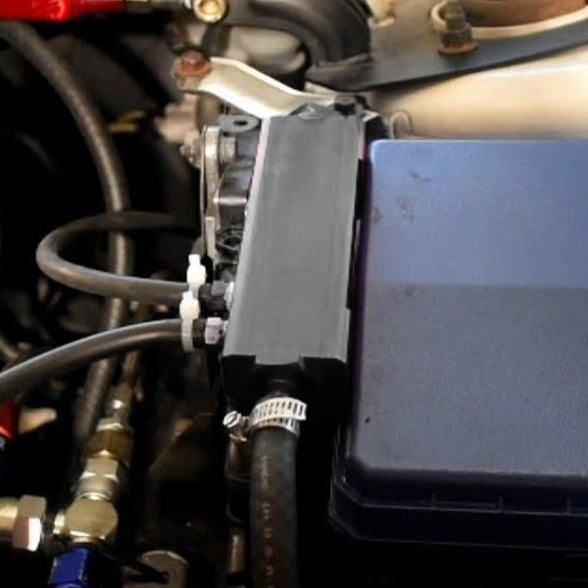 PQY vacuum manifold kit contents showing plugs and mounting hardware for quick installation