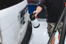 Microfiber wiping a panel after P&S rinseless wash leaving a smooth finish benefit