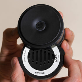 Pura Hawaii refill mounted in Pura Car diffuser demonstrating hands-free aroma benefit