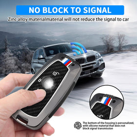 QBUC installed on BMW fob showing snug fit and preserved button responsiveness