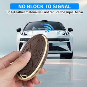 QBUC key fob in hand showing compact size and comfortable grip