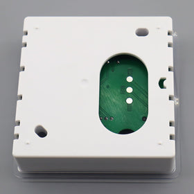 QHHR thermostat beside ruler showing compact size and easy fitting