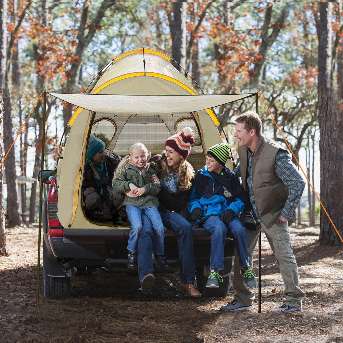 Qualencey with people next to tent demonstrating scale and sleeping capacity