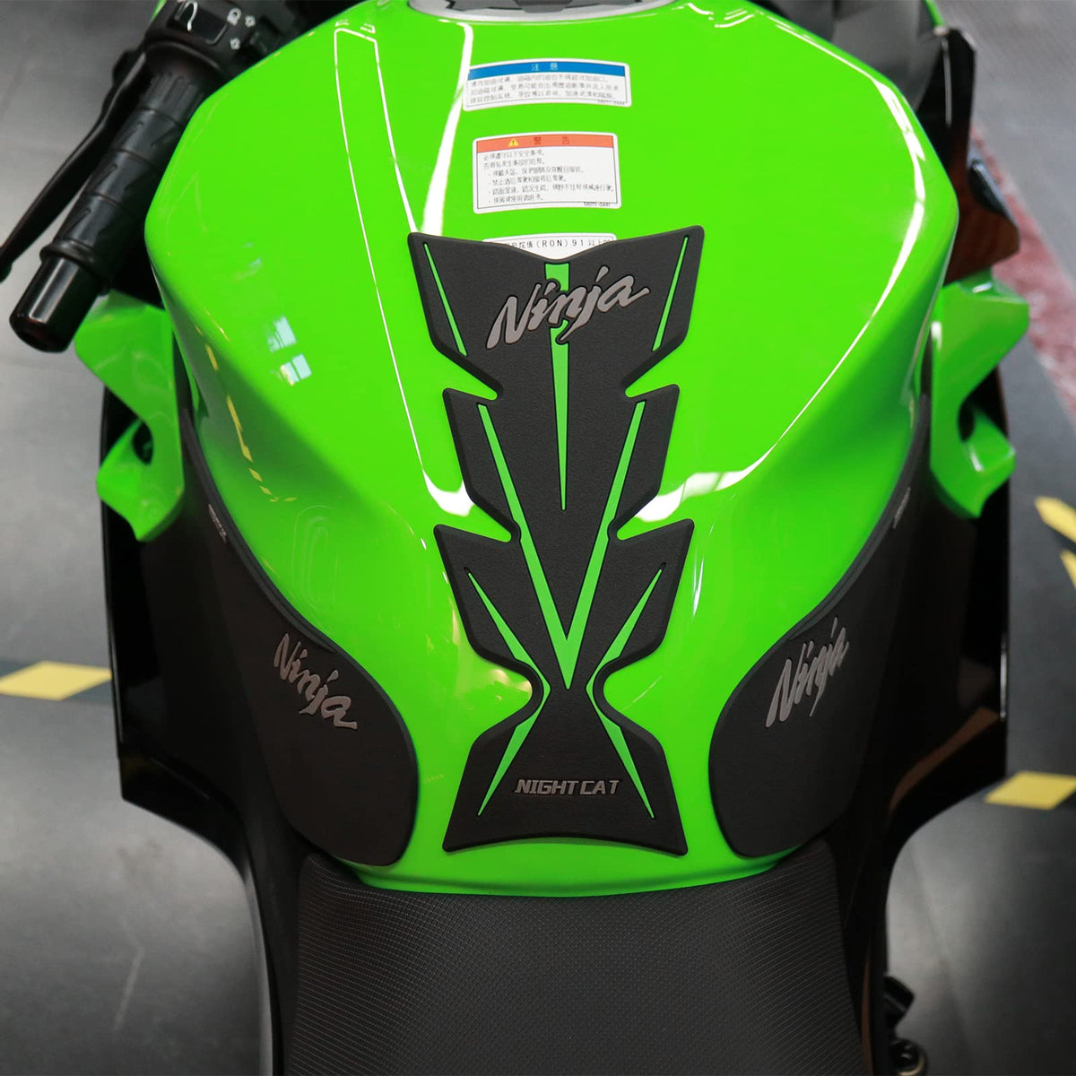 QUANT lifestyle shot on parked Ninja 400 for stylish protection