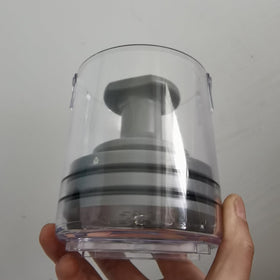 QUICKLO next to a hand for scale showing compact size and portability