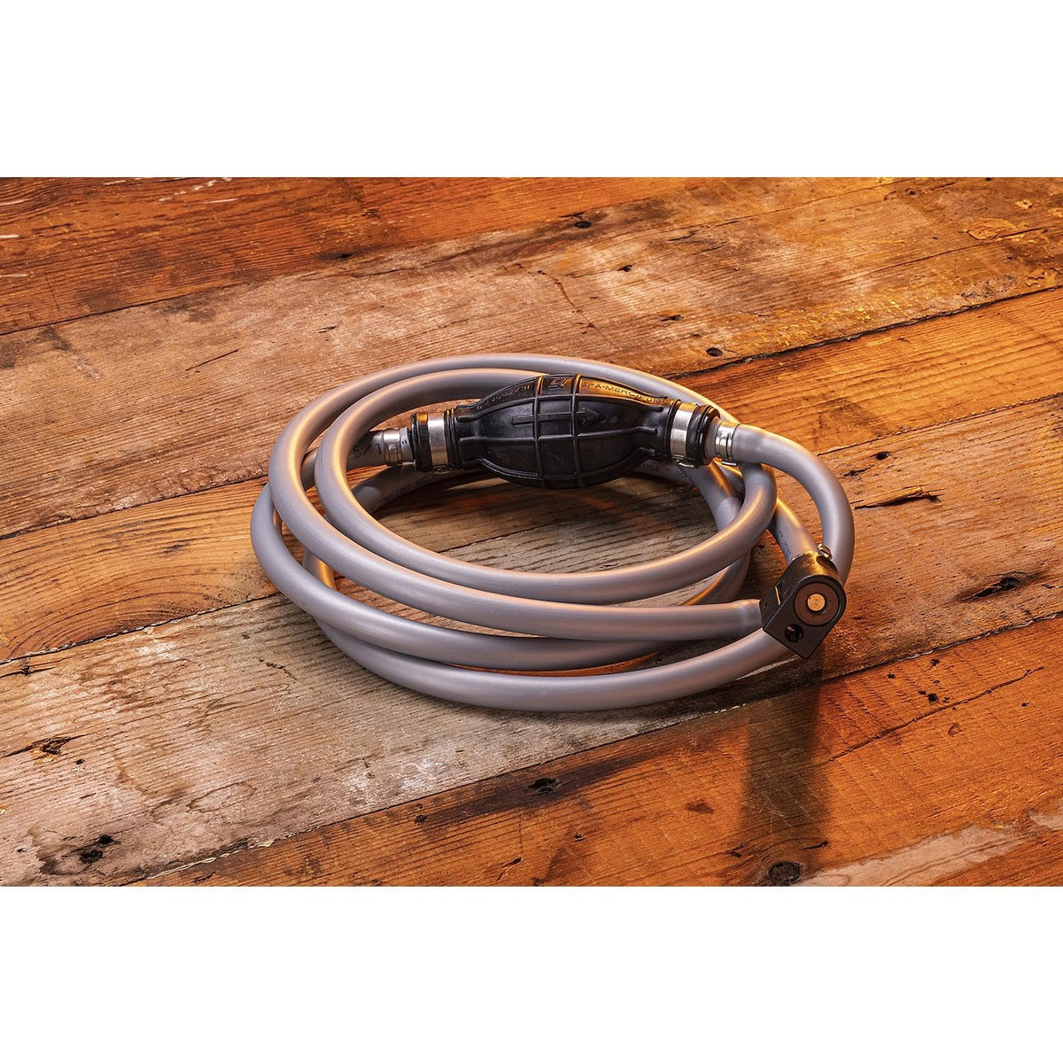 Quicksilver hose next to ruler showing full 8-foot length for fitment