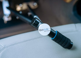 QuicStick next to ruler for size scale showing compact dimensions