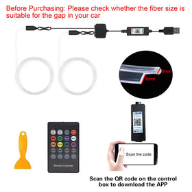 QVEVDACAR USB power and kit beside a hand for size and plug-in convenience