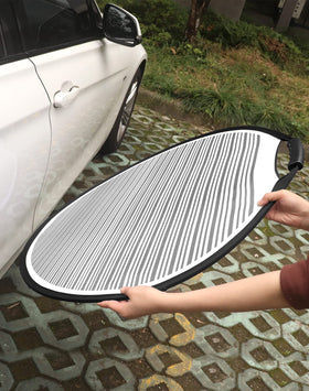 QWORK reflector board next to hand for scale to show portable 31.5-inch size