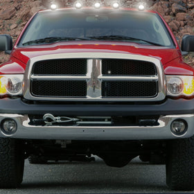 R&F Auto cab light next to ruler illustrating compact size and scale