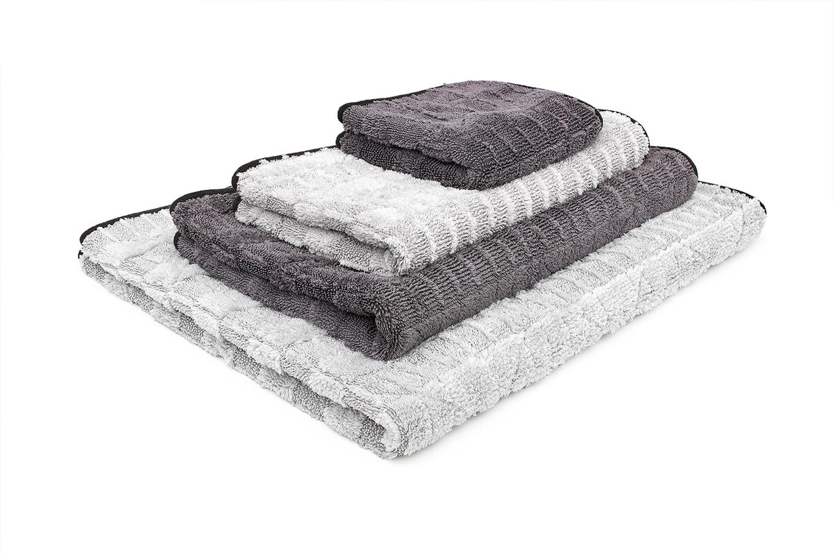 The Rag Company towel absorbing a large puddle to demonstrate capacity