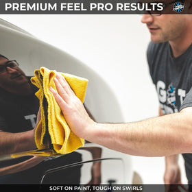 Rag Company towel removing wax from car paint demonstrating clean finish without scratches