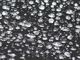 Raggtopp spray applied to convertible top in use demonstrating easy protection