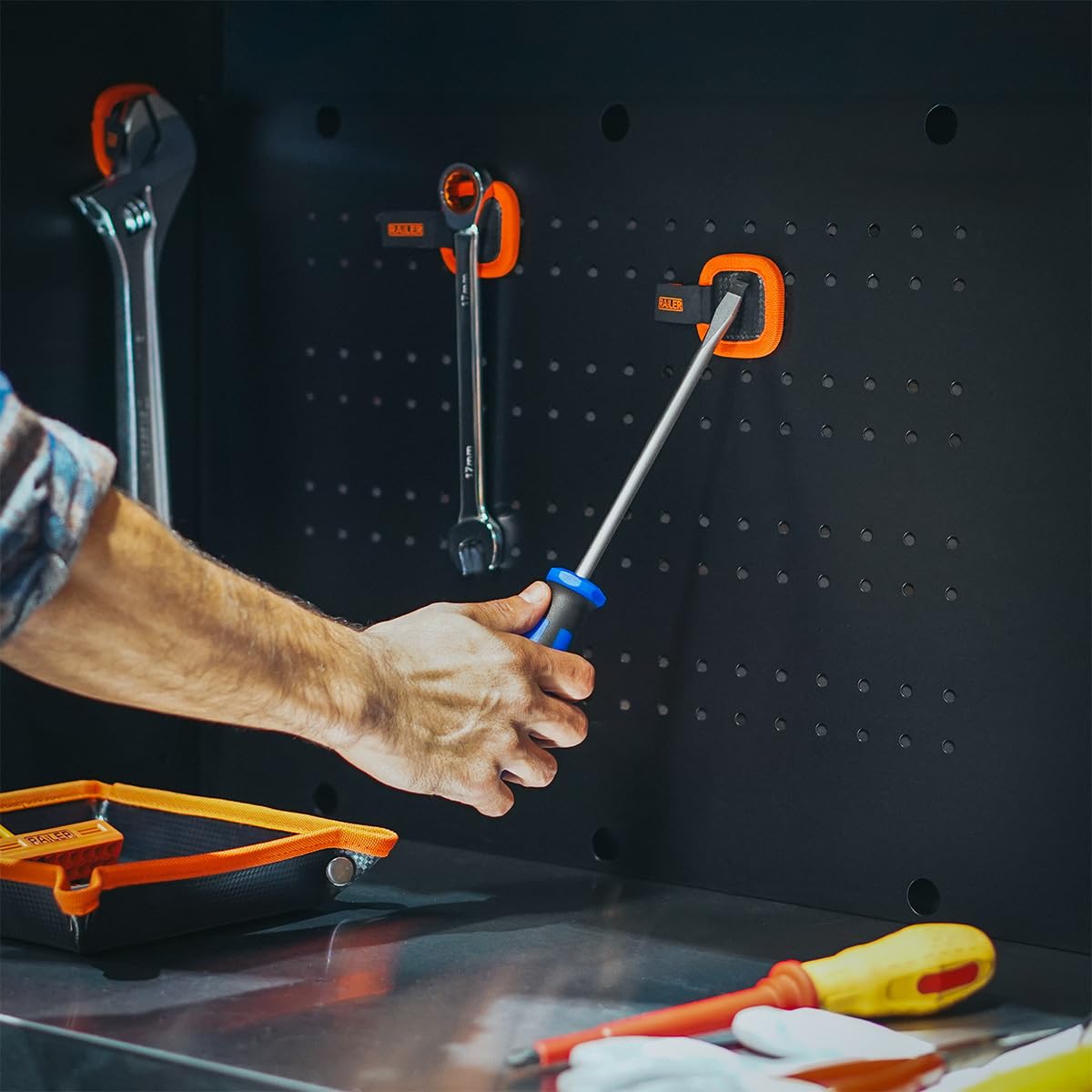 Railer beside wrenches showing size and capacity for efficient tool holding