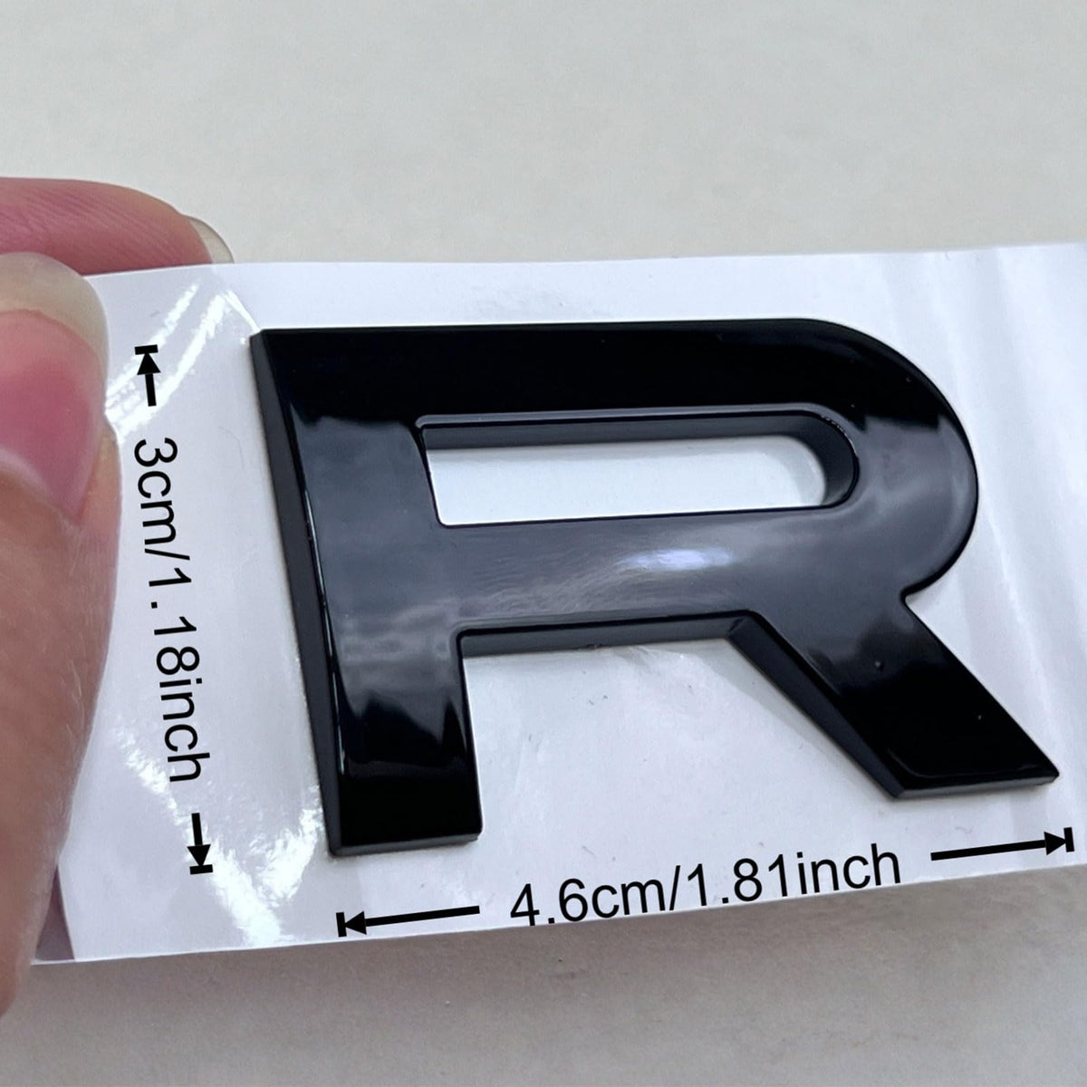 Generic Range Rover emblem close-up showing 3D raised texture and detailed depth benefit