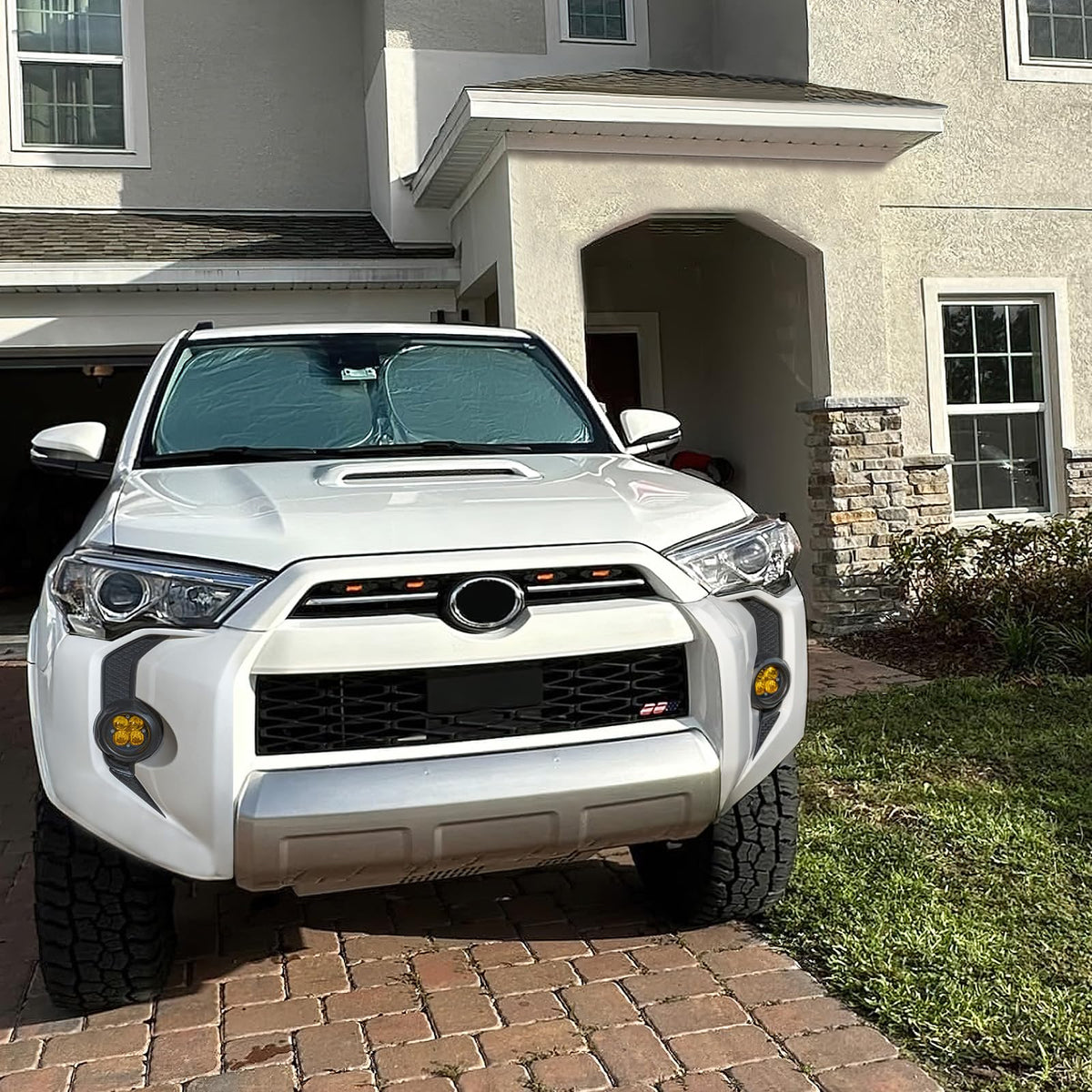 RAVOTOM lifestyle shot on road showcasing durable trim and enhanced front styling