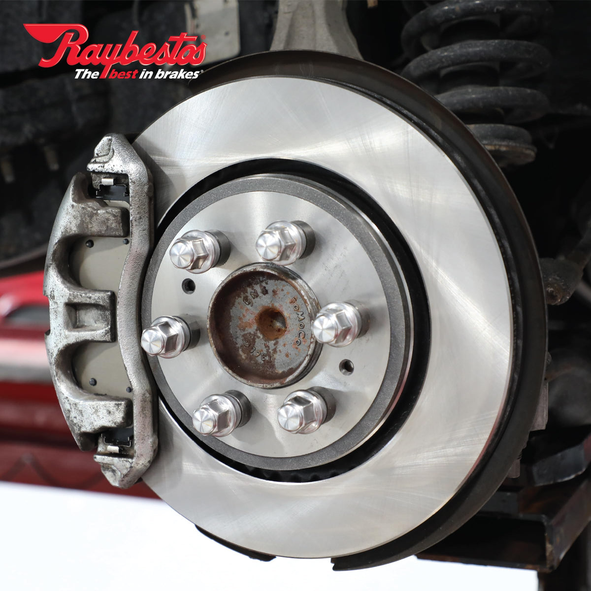 Raybestos rotor installed on vehicle hub demonstrating immediate compatibility
