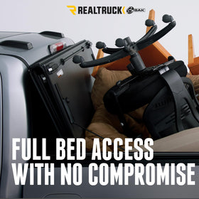 RealTruck BAKFlip MX4 in a camping setup showing protected cargo and usability