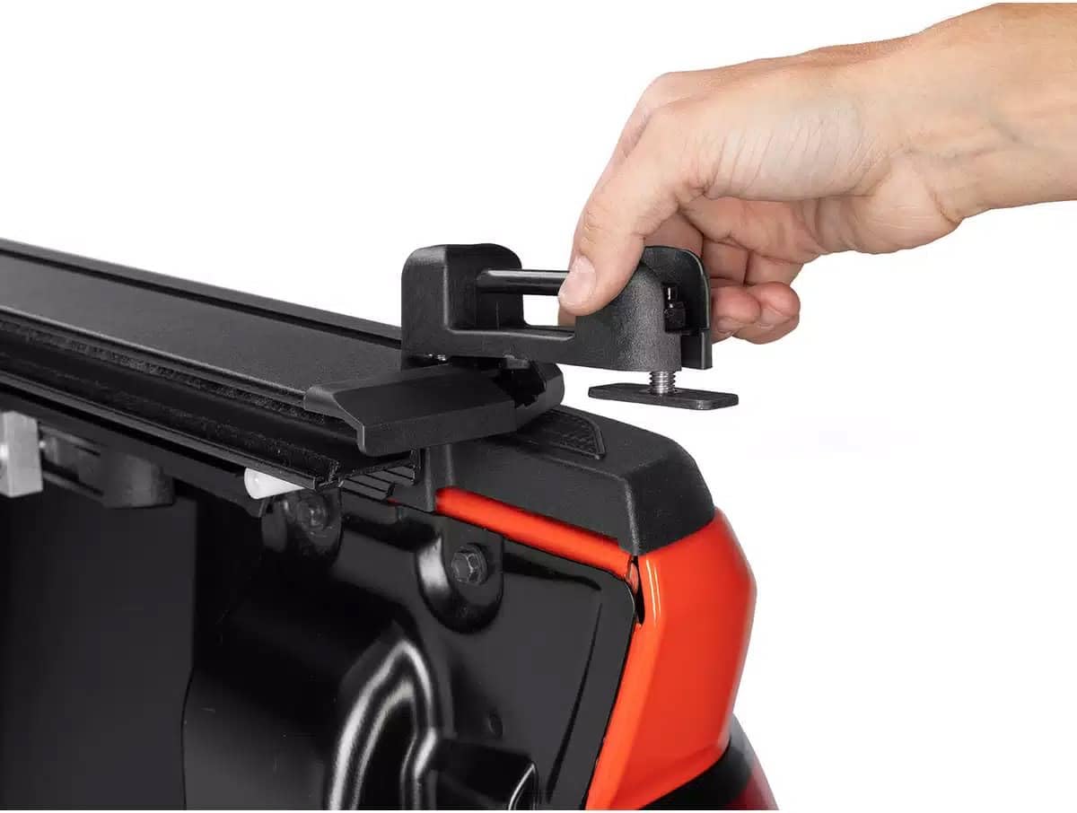 RealTruck Elevate cleat installed on T-slot rail with cargo strap showing secure load restraint