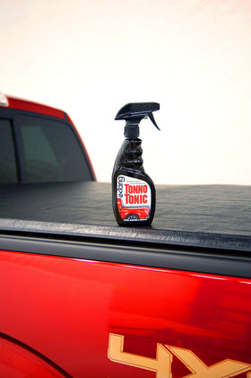 RealTruck Extang Tonno Tonic being sprayed on tonneau cover to restore finish and protect