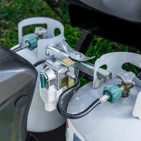 RecPro regulator next to common water bottle for scale showing compact lightweight design