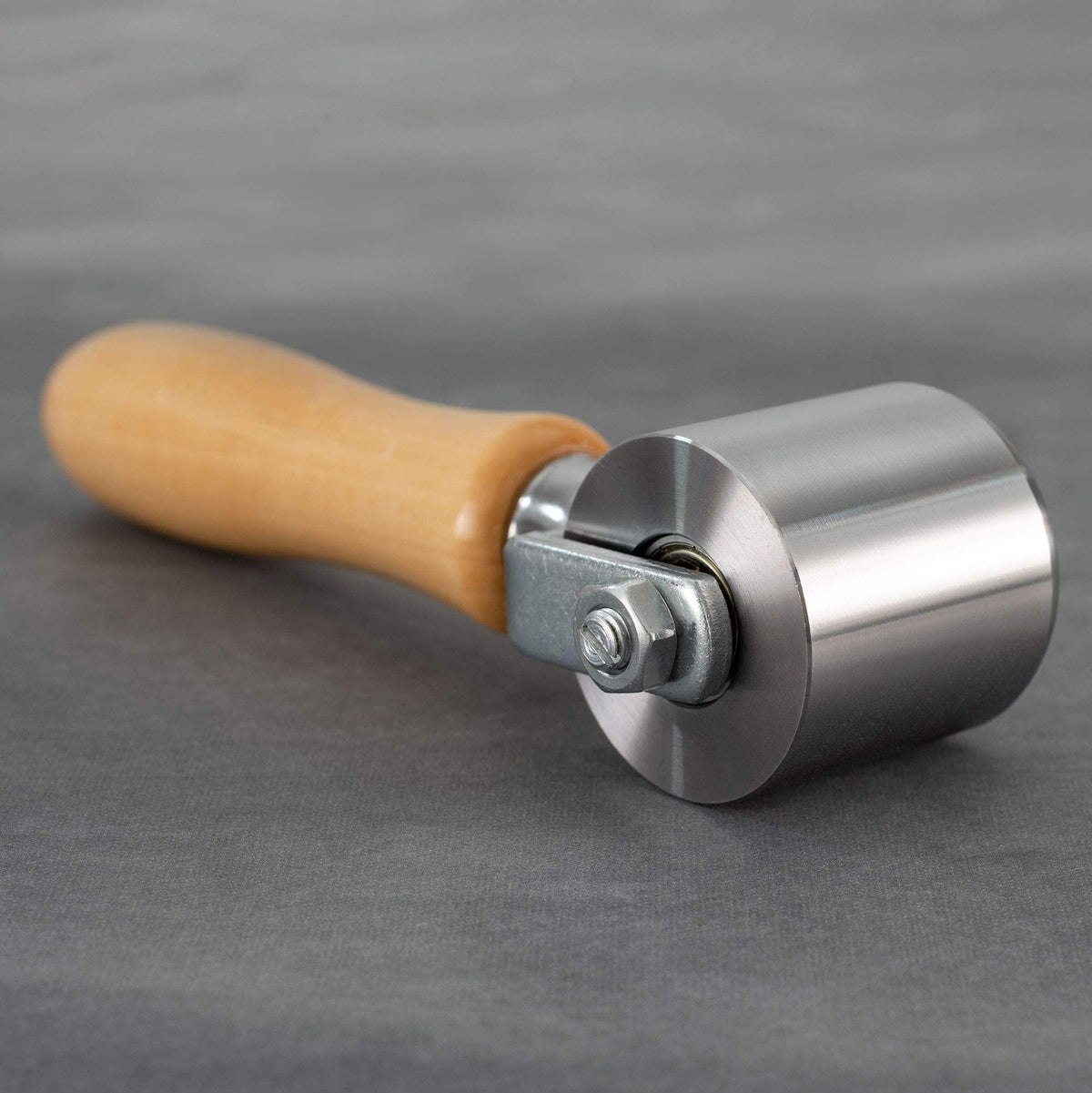 RecPro roller pressing vinyl plank seam for smooth, bubble-free finish