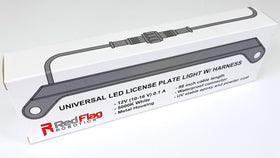 Red Flag Robotics installed on vehicle in evening demonstrating consistent plate illumination