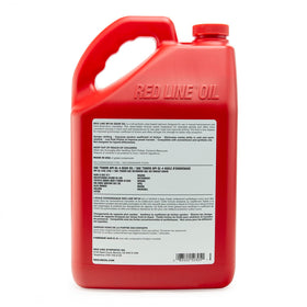 Red Line bottle placed in a garage setting for workshop readiness