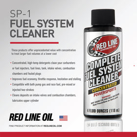 Red Line bottle being poured into a motorcycle fuel tank for cleaning