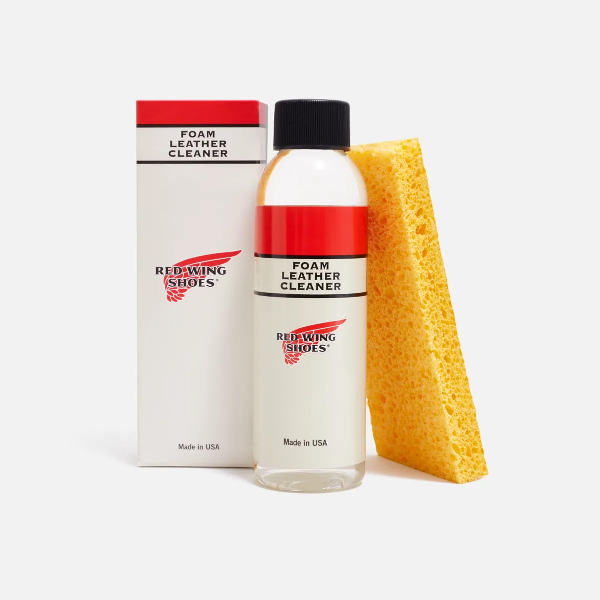 Red Wing Shoes sponge applying foam to leather boot for gentle cleaning
