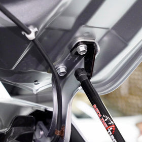 Redline Tuning black gas spring close-up highlighting durable coating and smooth action